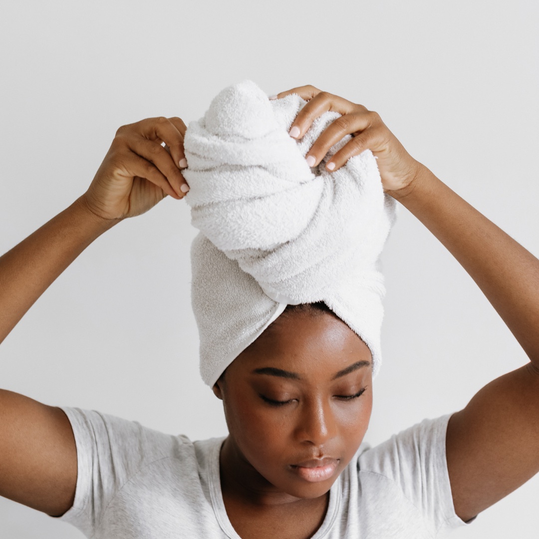 Woman with hair wrapped in a towel
