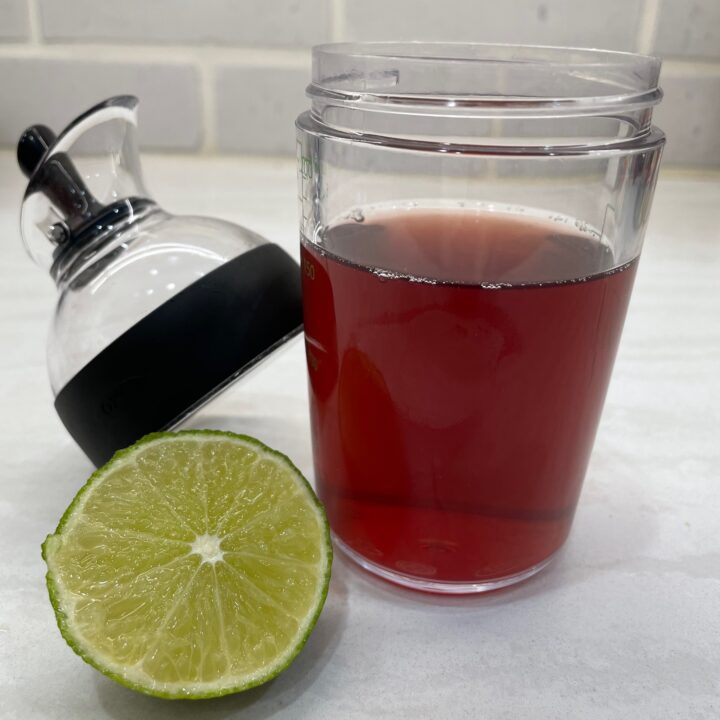 Bottle of juice with lime slice