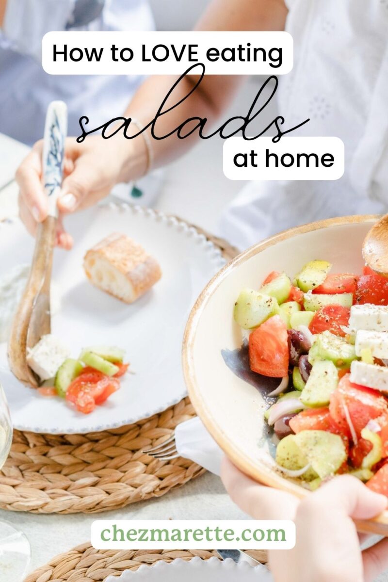 Serving a salad onto a white plate